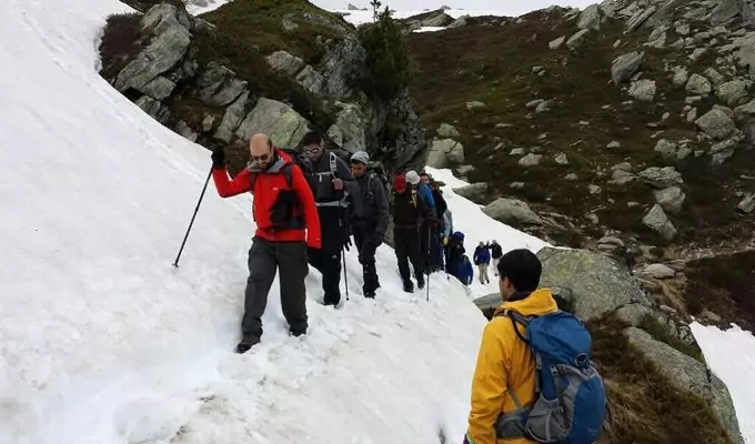 Hikers on a snowy trail