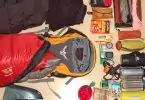 backpacking gear laid on floor