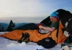 camper in winter sleeping bag