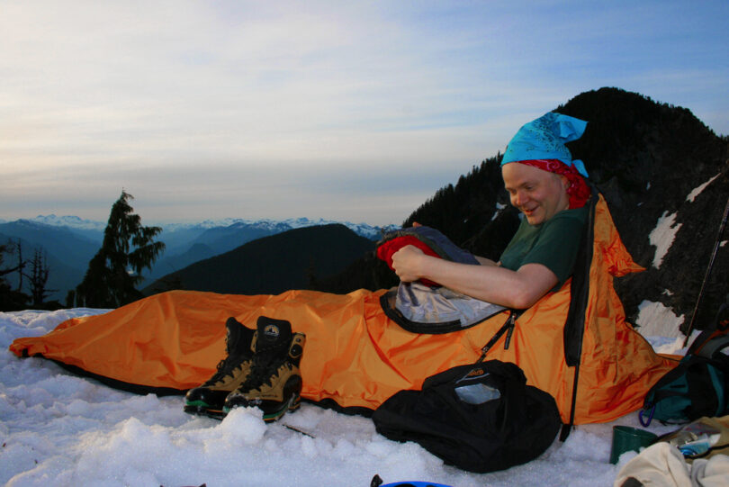 camper in winter sleeping bag