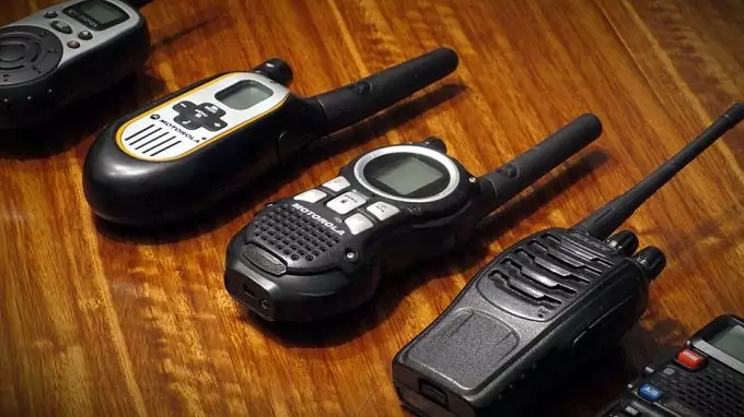 different types of walkies talkies on table