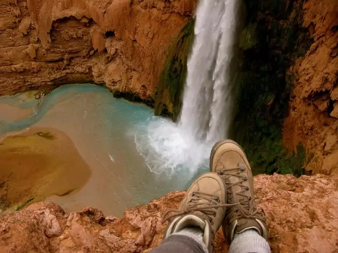 hiker wearing hiking shoes near waterfalls