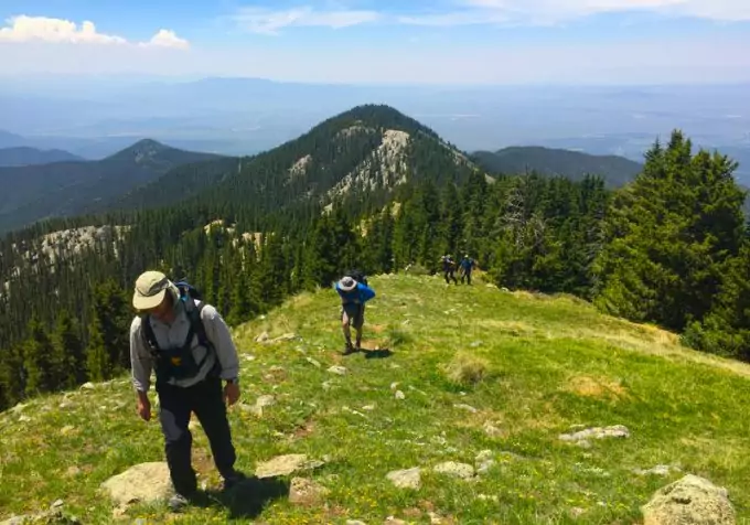 hikers on mountain with hiking shirts