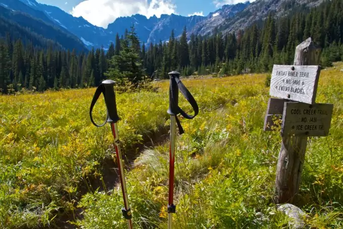 hiking poles next to hiking sign