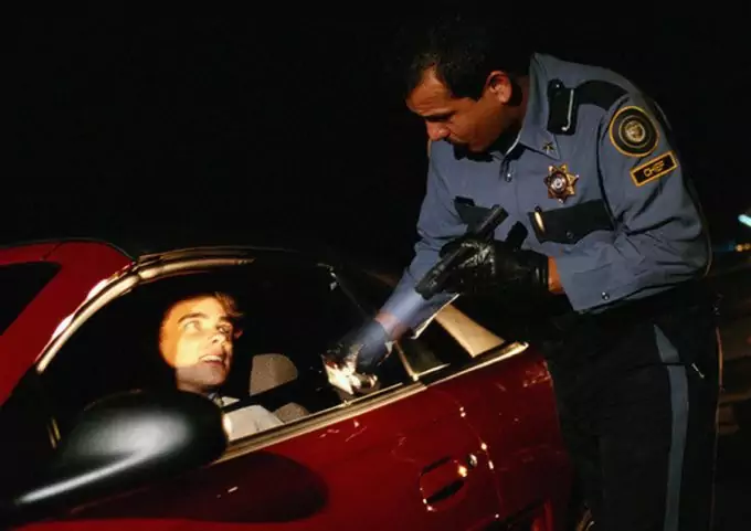 police officer holding tactical flashlight