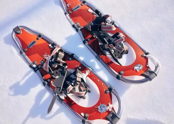 red snowshoes on snow