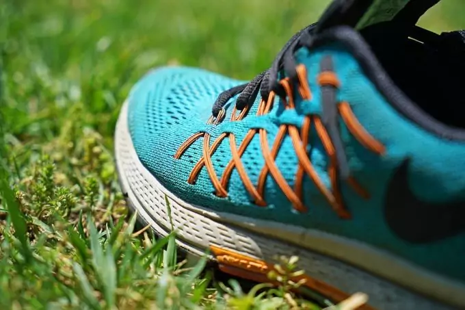 running shoes on grass