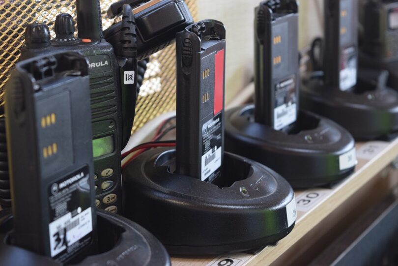 several brands of walkie talkies on shelf