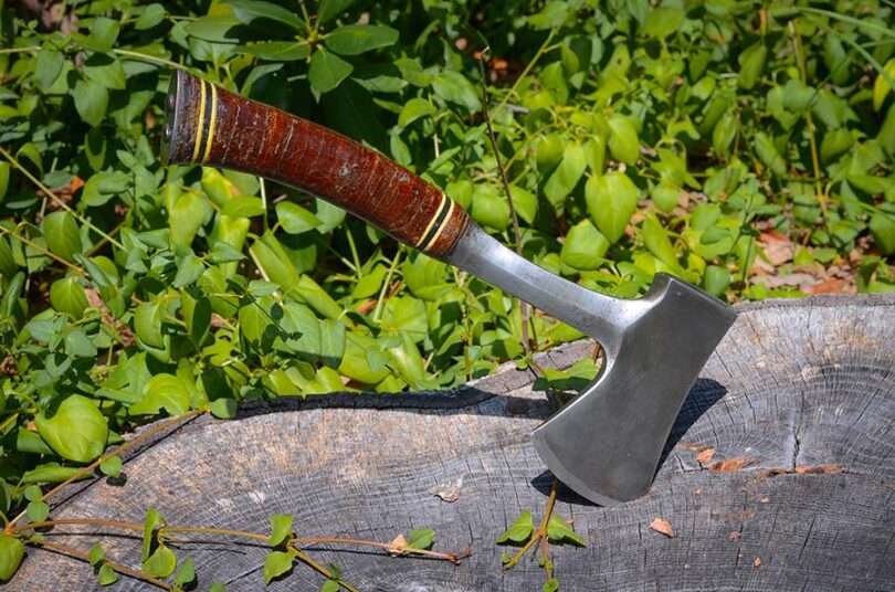 camping hatchet in wood