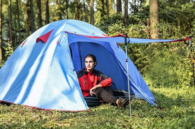 girl sitting inside tent
