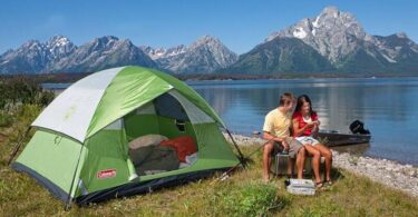 couple near lake with cheap tent