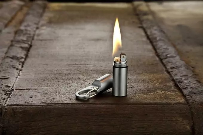 burning lighter on floor