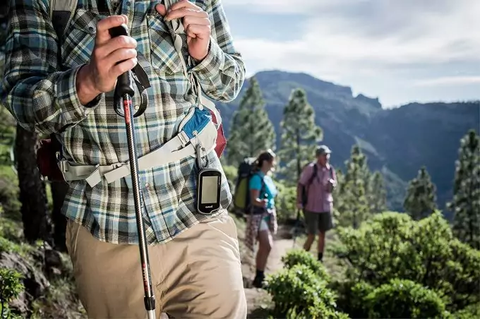 hiker wearing gps device on belt