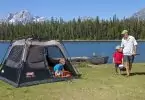 family camping in 4 person tent near the lake