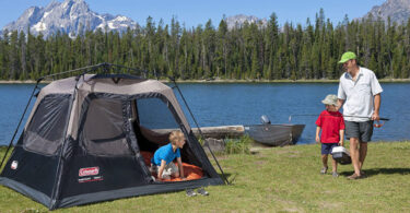 family camping in 4 person tent near the lake