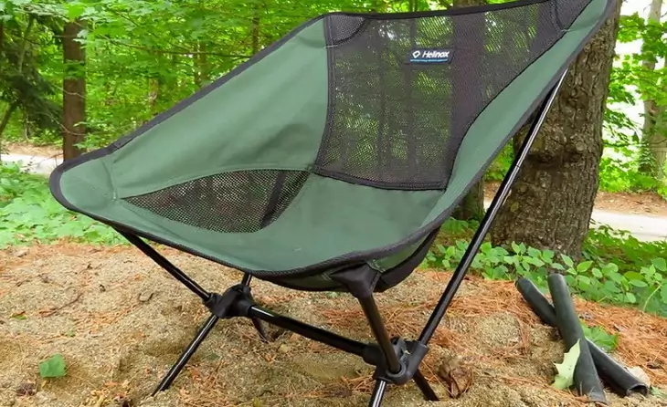 Front image of a backpacking chair in the forest