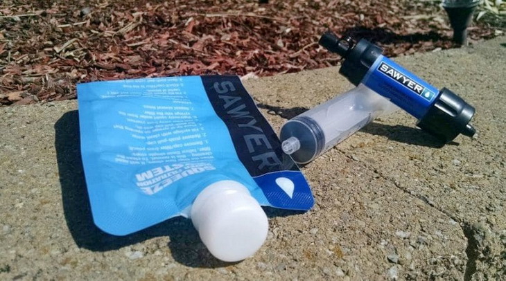 Sawyer-Backpacking-Water-Filter on the ground