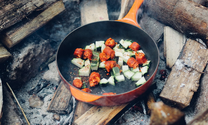 Preparing some meal on a campfire