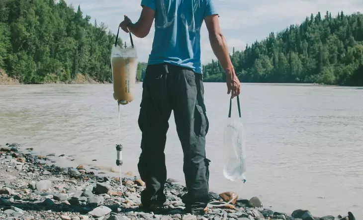 A man holding with his hands a Platypus-GravityWorks_Filter