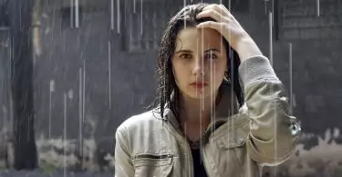 woman wearing a jacket standing in the rain