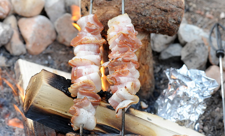 Cooking a meal on campfire