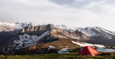 Image of a camping tent in a mountains landscape