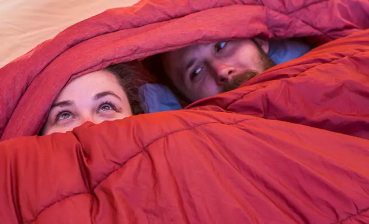 Two adult in a double-sleeping-bag