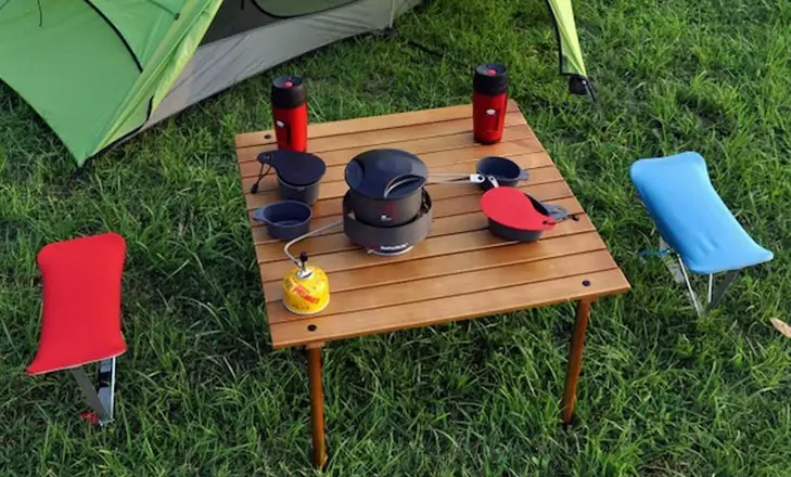 brown Folding Table on the gras