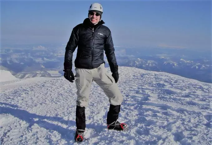 man in covertible pants on snow