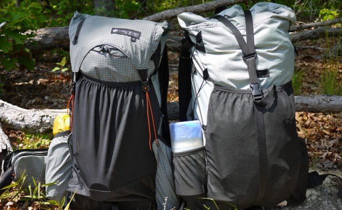 Image of two ultralight backpacks on the groud in the forest