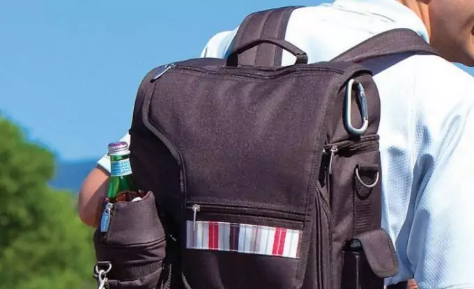 A man wearing a backpakc-cooler-with-side-pocket