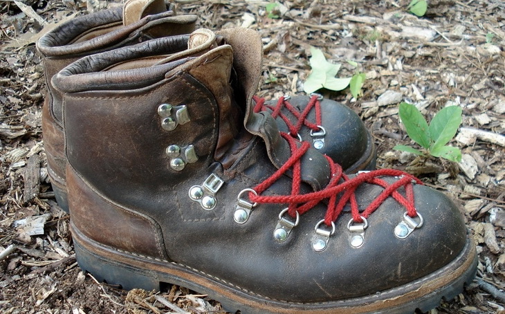 a pair of hiking boots on the ground