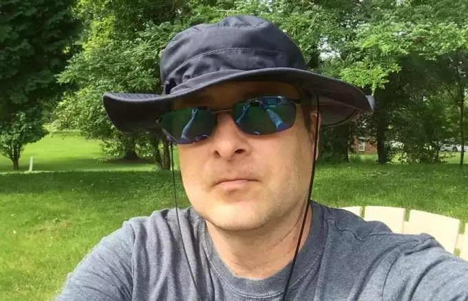 man wearing a boonie hat and sunglasses 