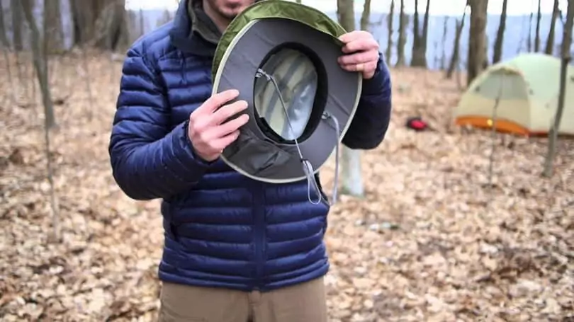 man holding a cowboy hiking hat