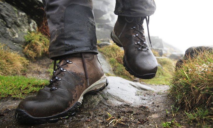 A man walking in a pair of winter hiking boots