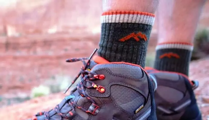 Close-up image of a hiker's legs while wearing socks