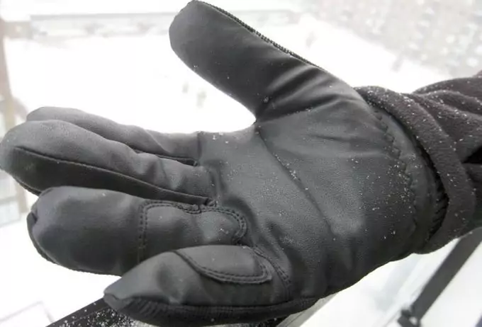Image of a man wearing waterproof-winter-gloves