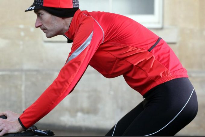 cyclist wearing SOFTSHELL dwr JACKET