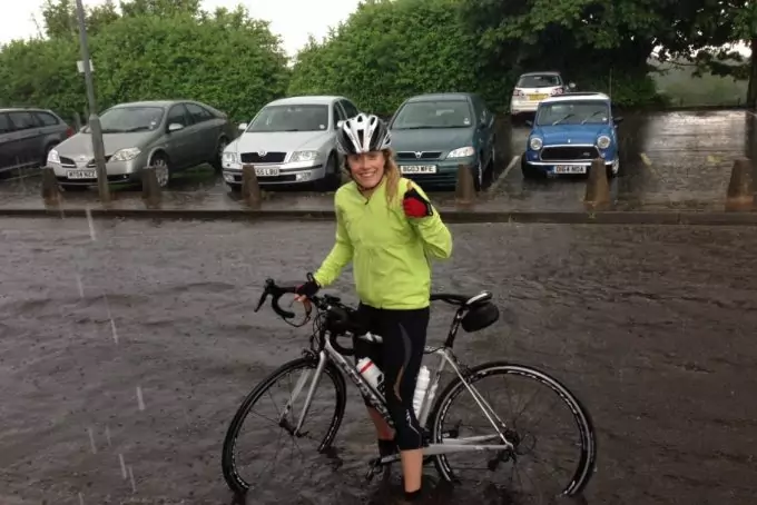 cyclist woman in rain jacket