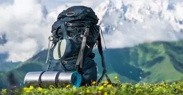 Tourist backpack and sleeping pad on a background of mountains, Georgia (Svaneti)