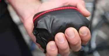 packable rain jacket in hand