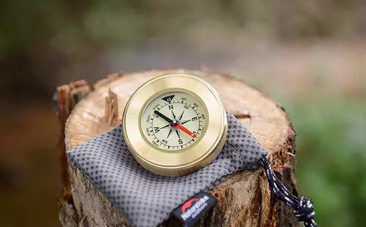 Image showing a compass on a wood