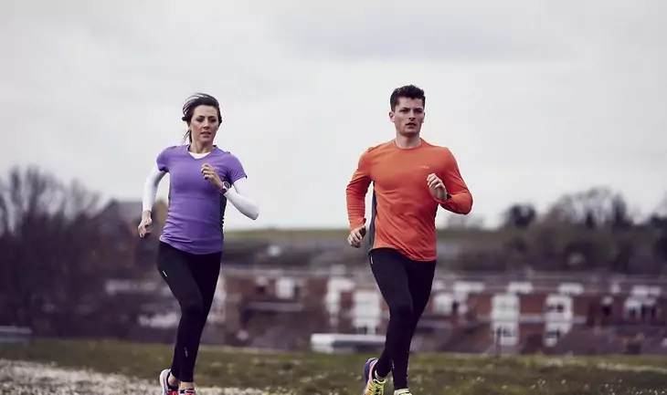 Image of two runners wearing base layers