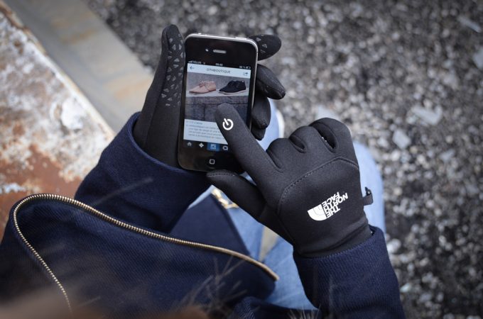 touching screen with woman winter gloves