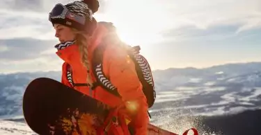 woman snowdoarder in snow coat