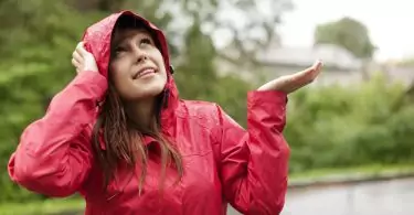 woman standing in the rain with jacket