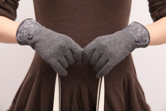 woman wearing fleece gloves