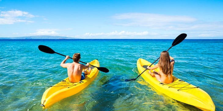 Couple on single kayaks