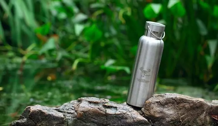 A stainless-steel-water-bottle in the nature
