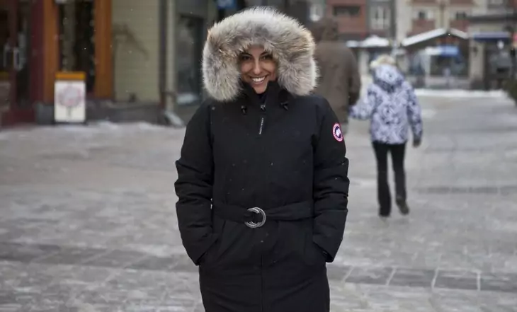 Woman wearing Canada Goose smilling at the camera